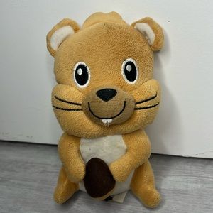 Cute plush squirrel holding acorn
